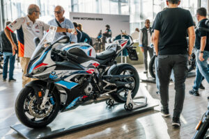 Area espositiva dell'Eternal City Moto Show al Gazometro di Roma con stand e aree prova
